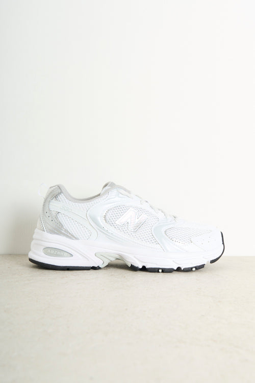 Women's white and silver running sneakers