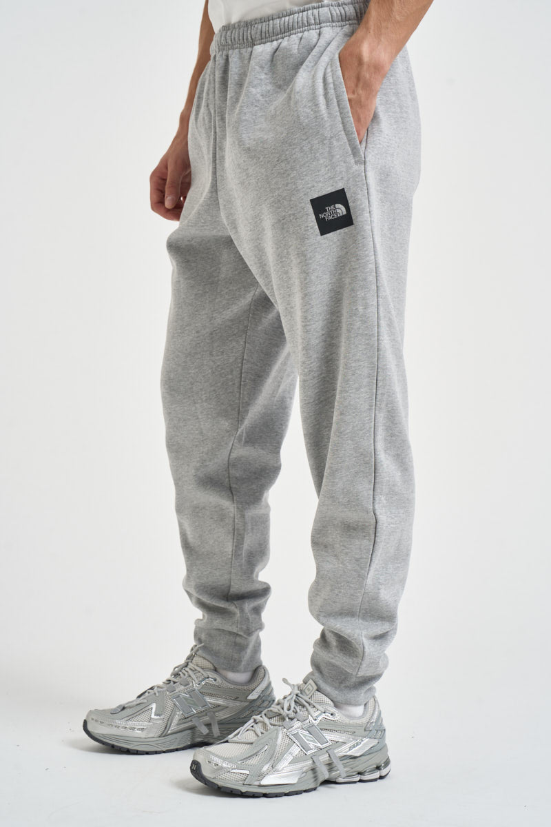 Pantaloni uomo tuta grigio melange 8JB0 CQO THE NORTH FACE 
