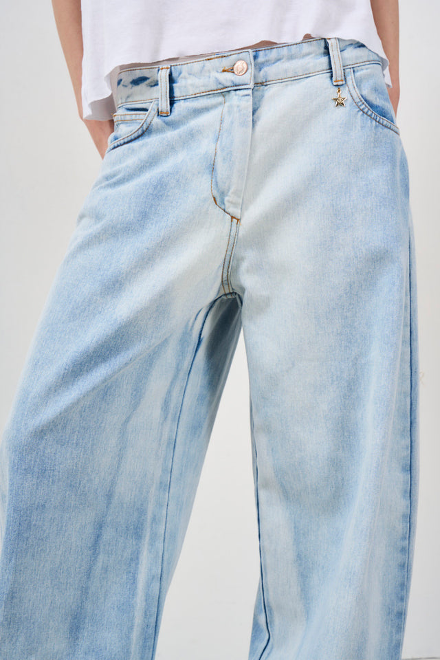 Women's jeans in badly dyed denim