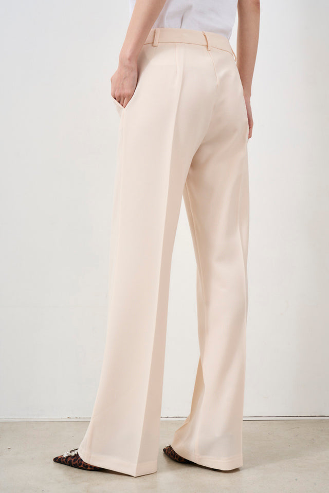 TENSION IN Elegant milk-colored trousers