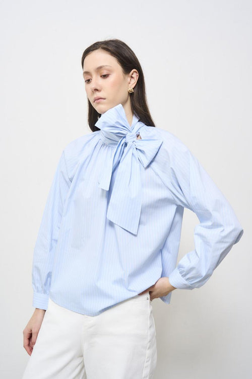 Women's blouse with light blue bow