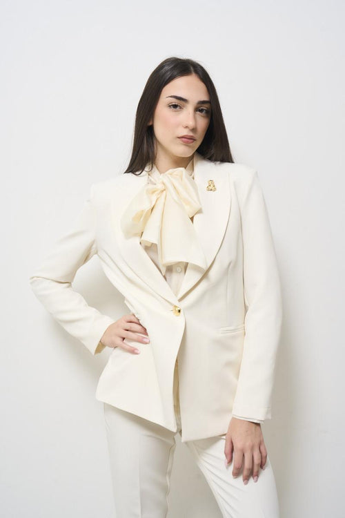 Cream women's jacket with brooch